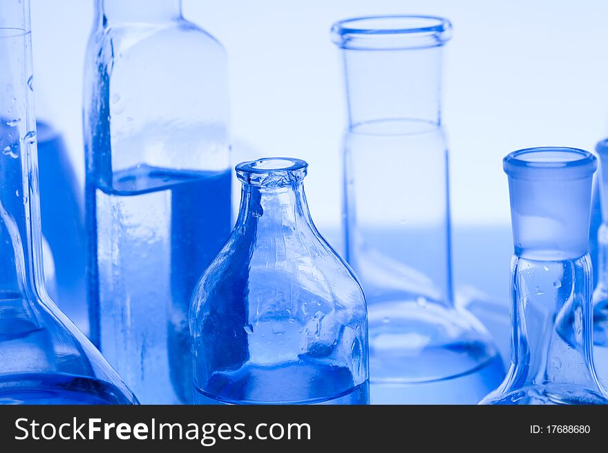 Laboratory glass. Glassware on the blue background.