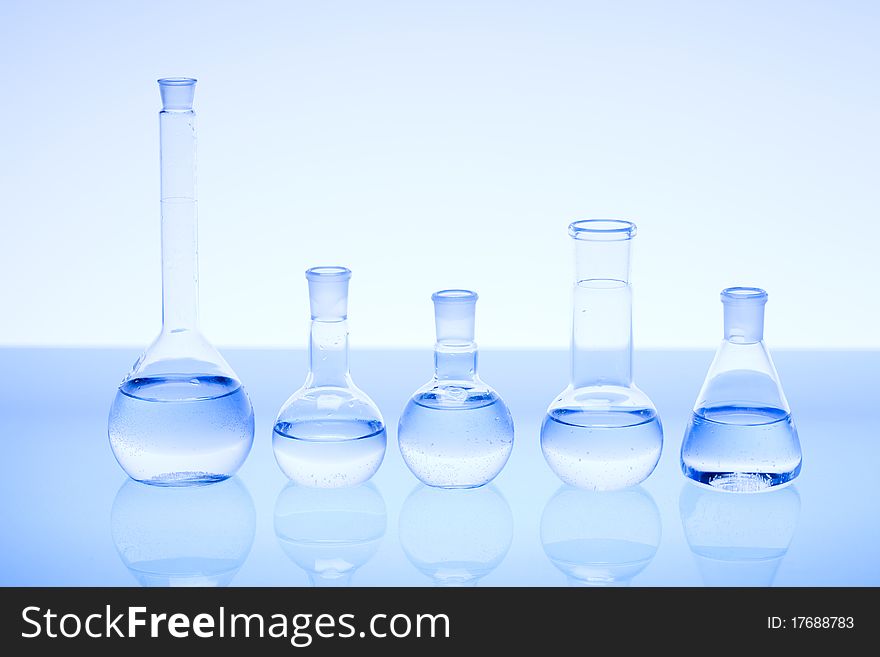 Laboratory glass. Glassware on the blue background.