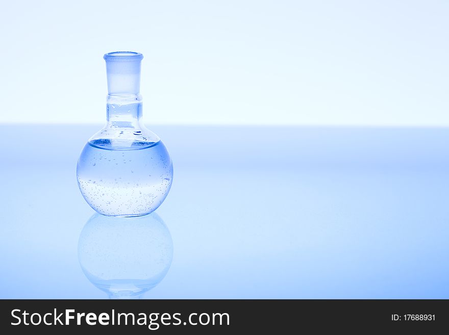 Laboratory glass. Glassware on the blue background.