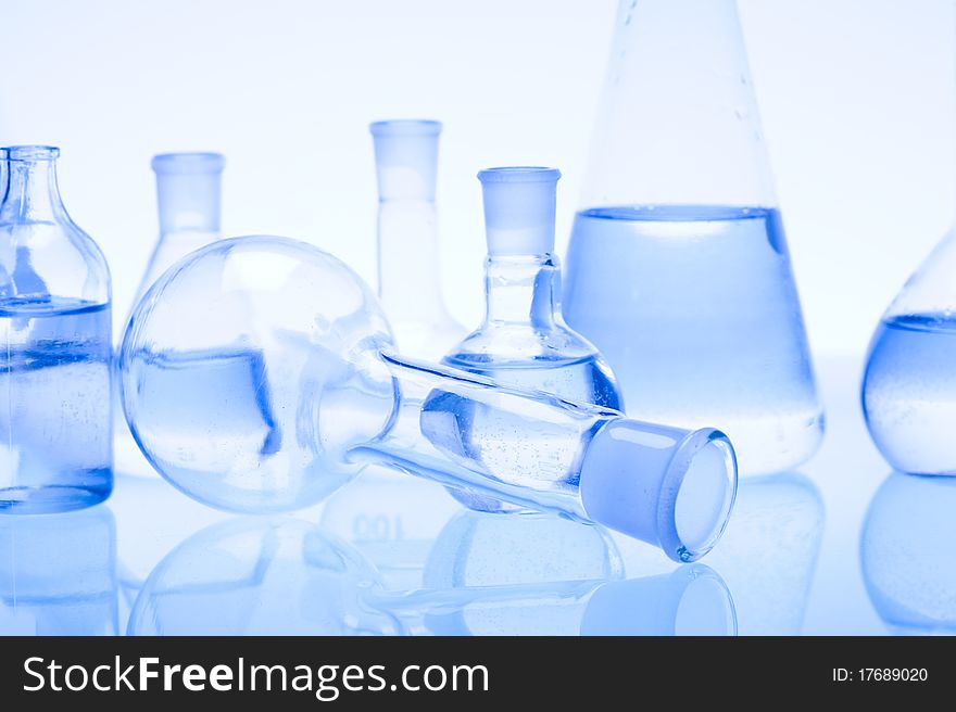 Laboratory glass. Glassware on the blue background.