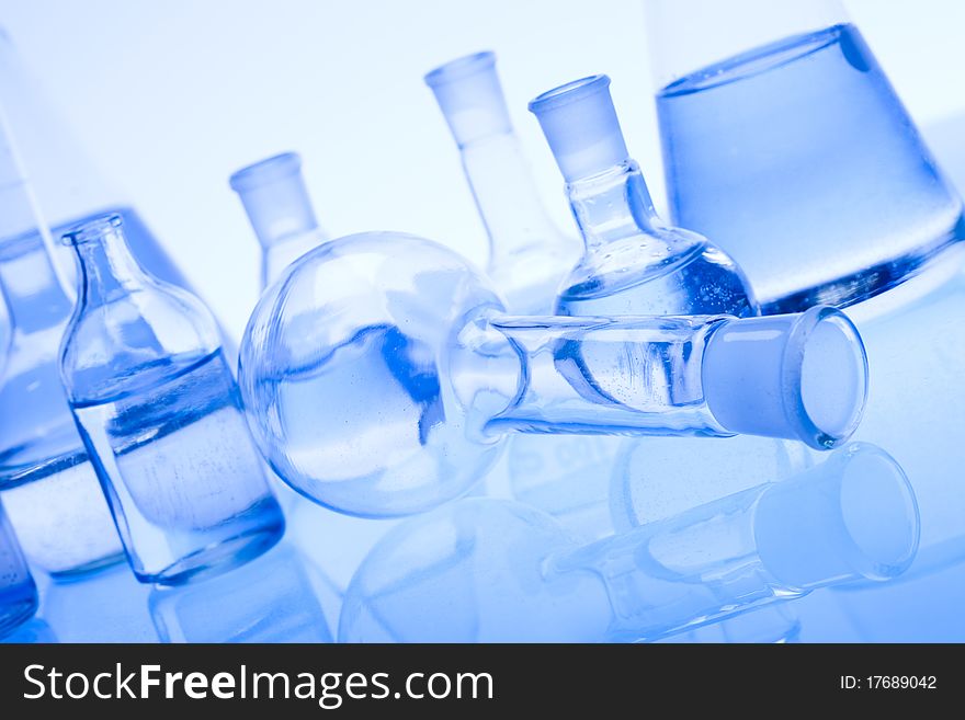 Laboratory glass. Glassware on the blue background.