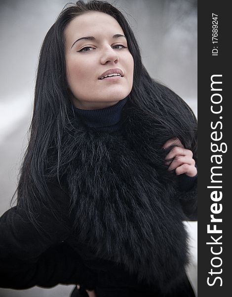 Charming Young Woman In Fur Clothes