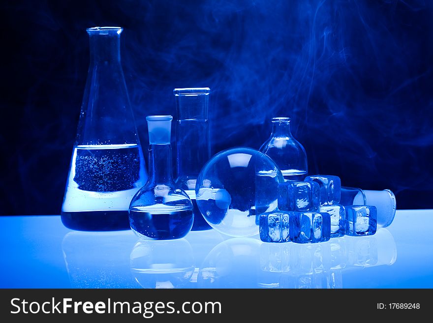 Laboratory glass. Glassware on the blue background.