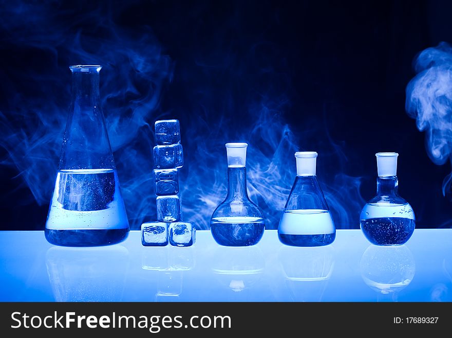 Laboratory glass. Glassware on the blue background.