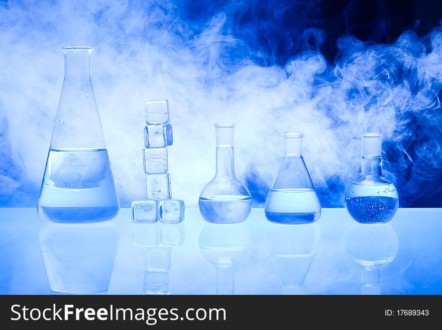 Laboratory glass. Glassware on the blue background.