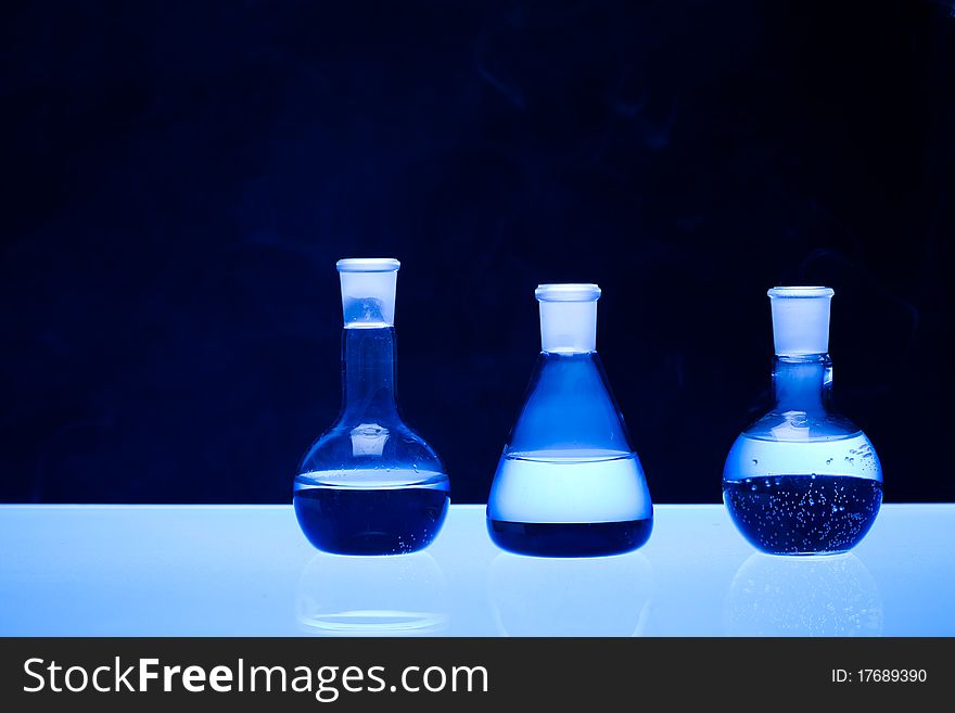 Laboratory glass. Glassware on the blue background.
