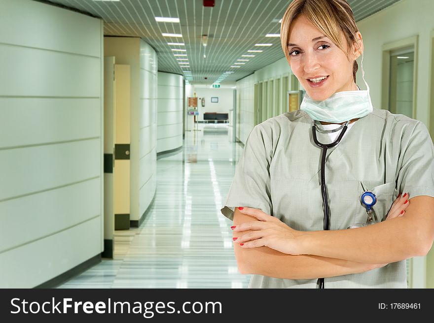 Smiling confident medical staff standing in her uniform. Smiling confident medical staff standing in her uniform