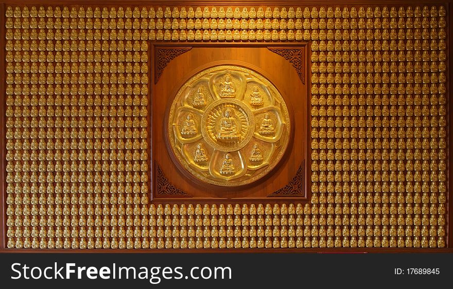 Image of golden Buddha in Chinese temple wall. Image of golden Buddha in Chinese temple wall