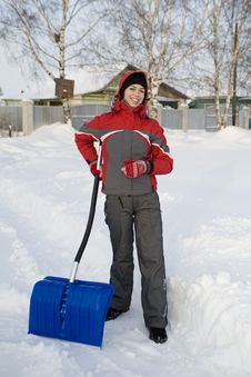 The Girl In A Winter Sports Jacket Holds A Shovel Royalty Free Stock Photo The Girl In A Winter Sports Jacket Holds A Shovel Royalty Free Stock Photo