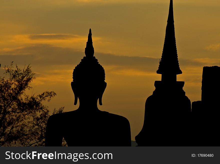 Silhouette of buddha statue at the temple in Thailand
