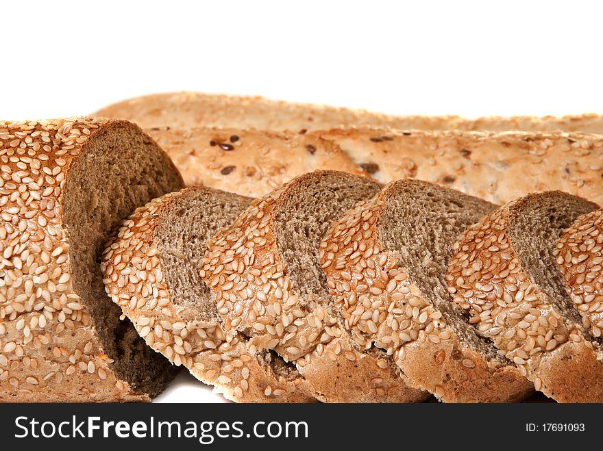 Three baguettes with sesame on a white background