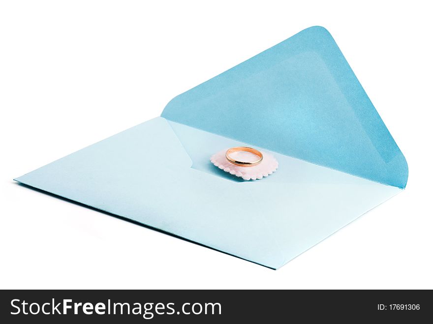 Wedding ring on the mail envelope, white background