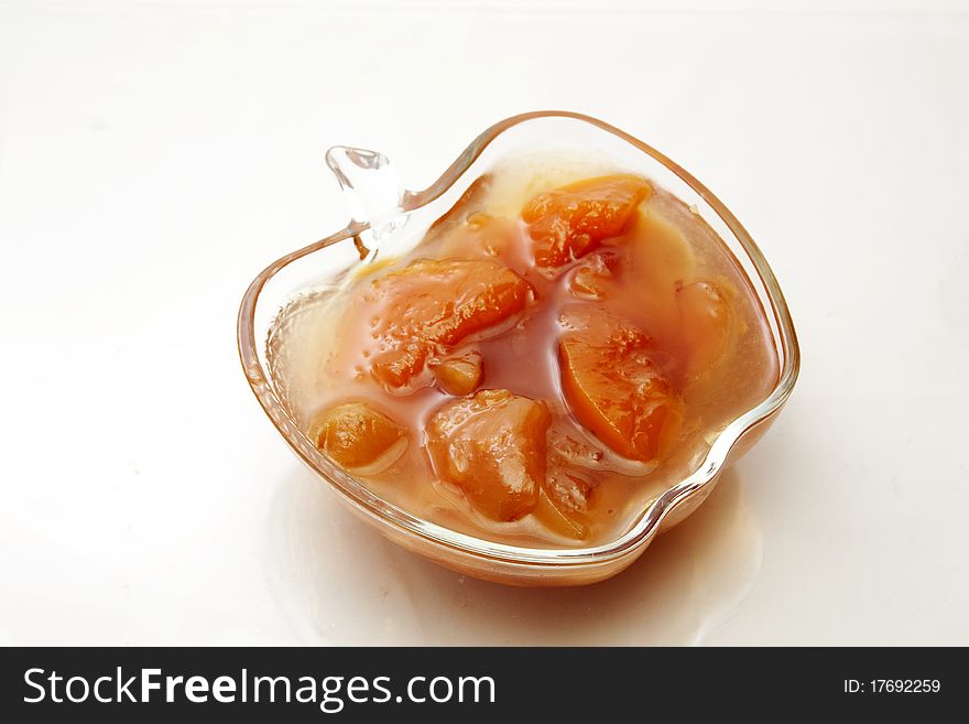 Fragrant fruity peach jam in a glass vase