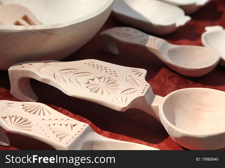 Traditionally carved wooden spoons and plates