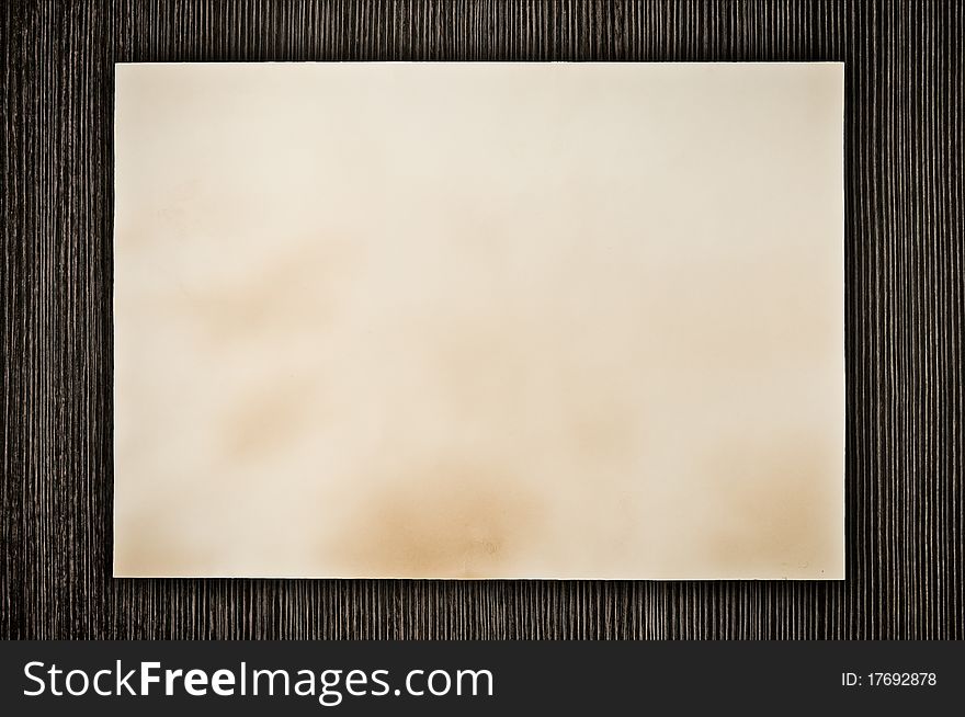 Grunge old paper on wood background. Grunge old paper on wood background