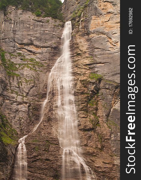 Small waterfall with brown rocks near Lauterbrunnen. Small waterfall with brown rocks near Lauterbrunnen