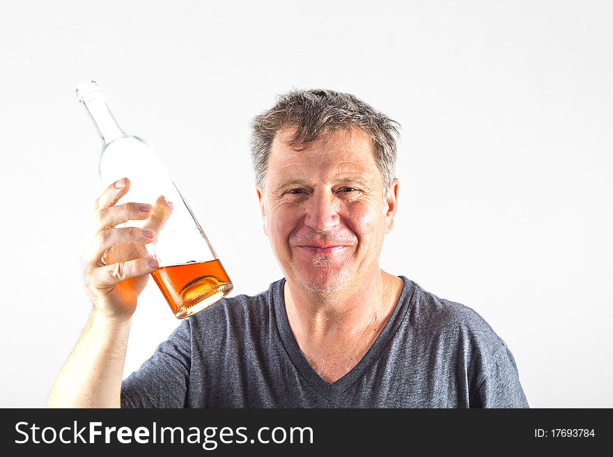 Man drinking alcohol out of a bottle