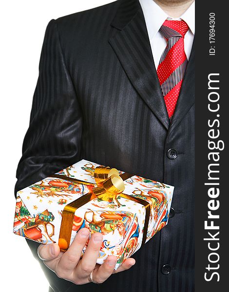 The businessman in a black suit has control over a celebratory gift. The businessman in a black suit has control over a celebratory gift