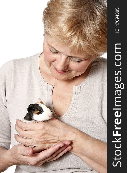 Senior woman holding guinea pig - pet therapy