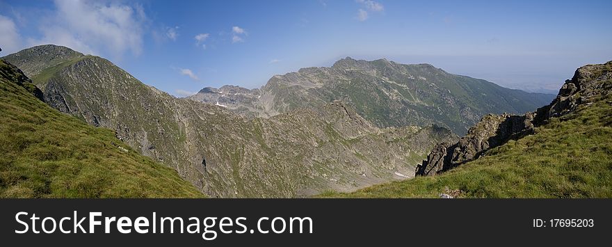 Carpathian Mountains. In background you can see Negoiu Peak on the right side and Lespezi Peak on the left side. Carpathian Mountains. In background you can see Negoiu Peak on the right side and Lespezi Peak on the left side.