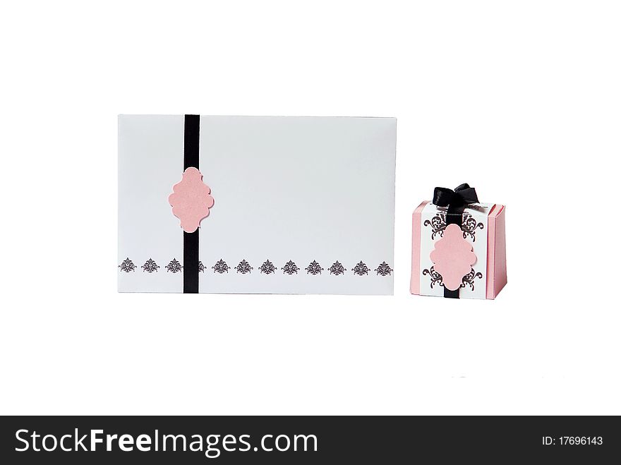 Wedding invitation and gift box with black ribbon isolated on a white