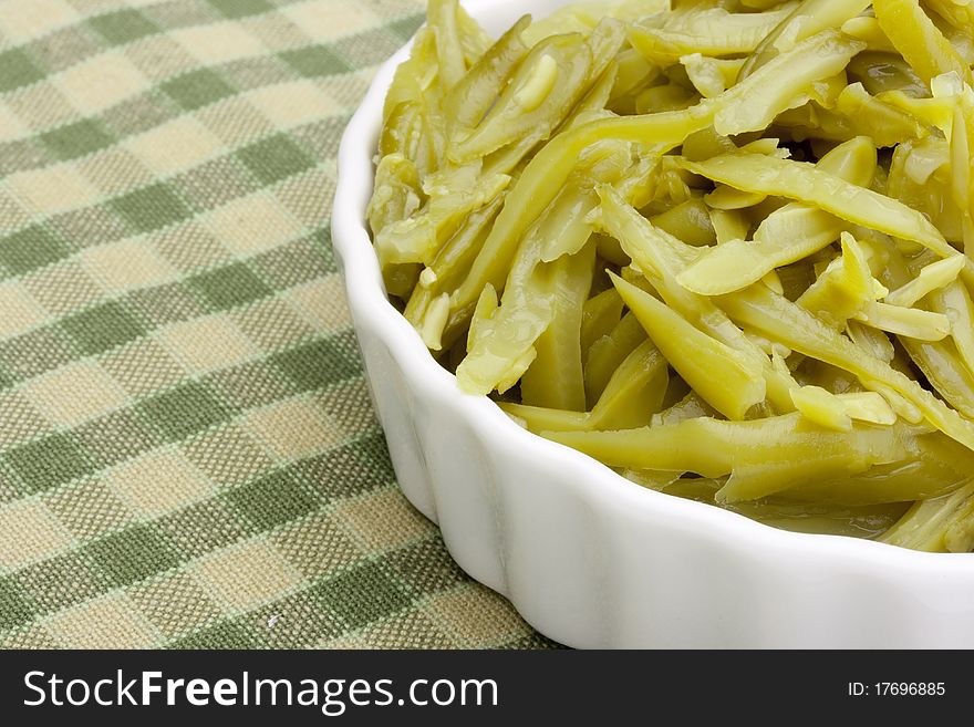 Chopped chillies marinated green beans from the metal cans.