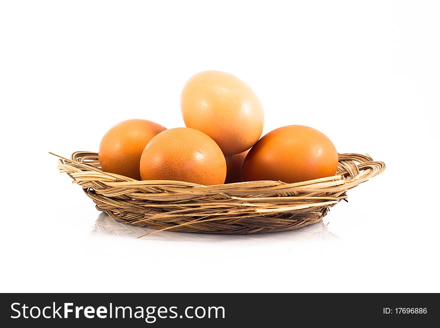 Eggs in the basket isolated