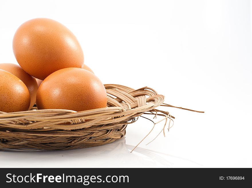 Eggs in the basket isolated