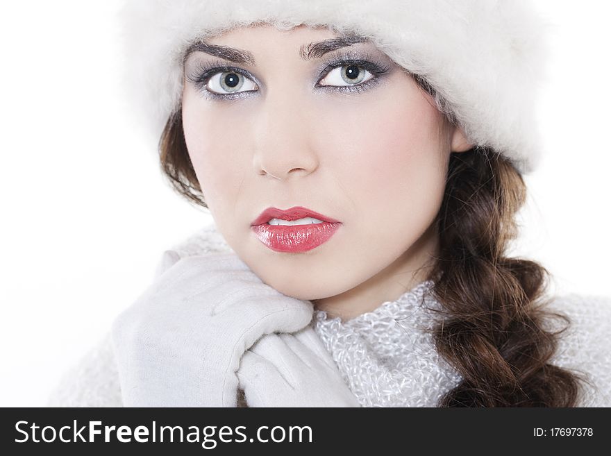 Close-up portrait of beautiful pure young woman wearing winter clothing