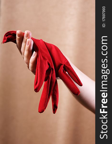 Woman`s hand with red gloves