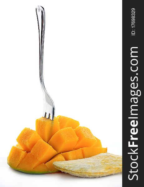 Fresh mango with fork isolated on a white background. Fresh mango with fork isolated on a white background