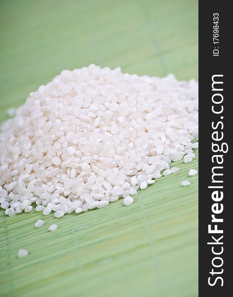 White rice on green background