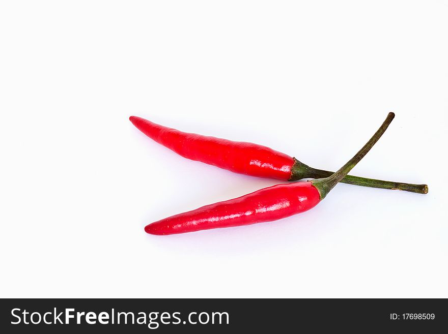 Red hot chili peppers on white background