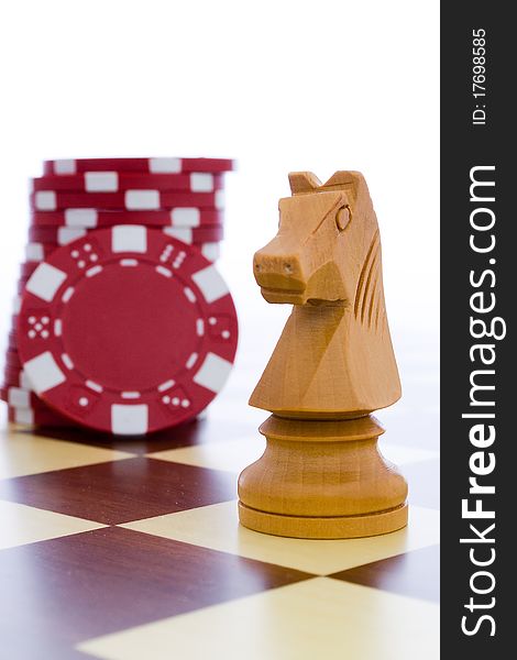 White horse and red chips in the chessboard. White horse and red chips in the chessboard