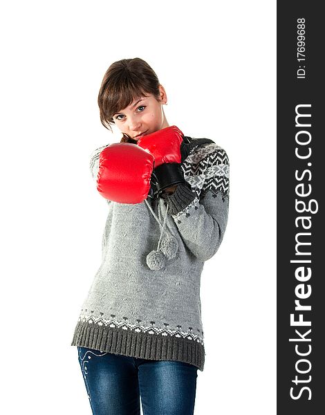 Beautiful girl in boxing gloves punching isolated on white