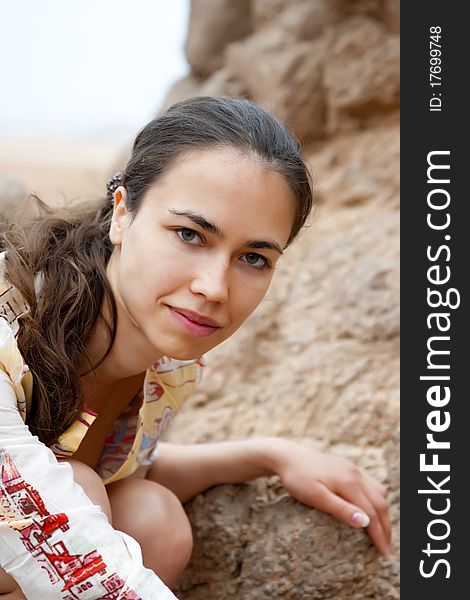 The beautiful girl the brunette in mountains to desert a portrait