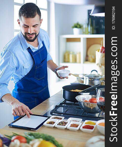 Man Preparing Delicious And Healthy Food In The Home Kitchen