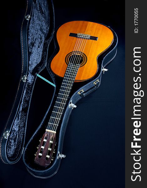 A close-up view of acoustic guitar in a guitar box