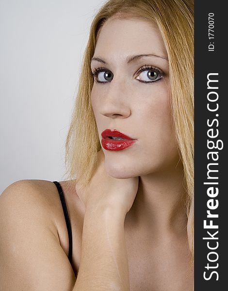 Woman puckering up with red lipstick. Woman puckering up with red lipstick