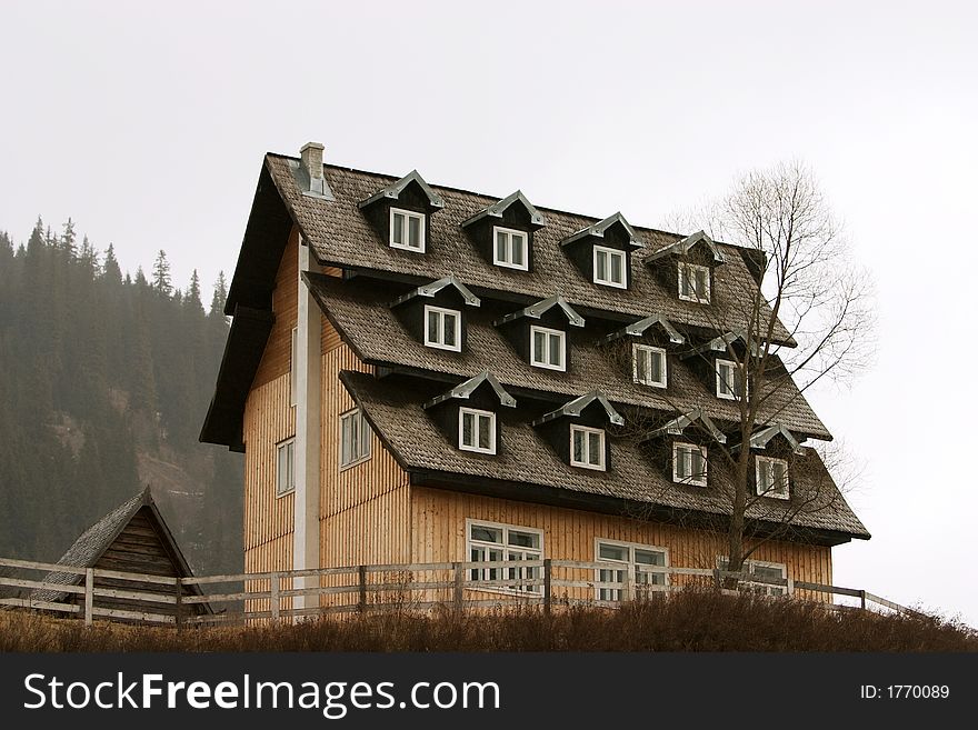Cottage with a roof full of windows. Cottage with a roof full of windows