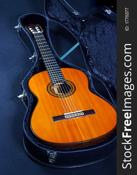 A close-up view of acoustic guitar in a guitar box