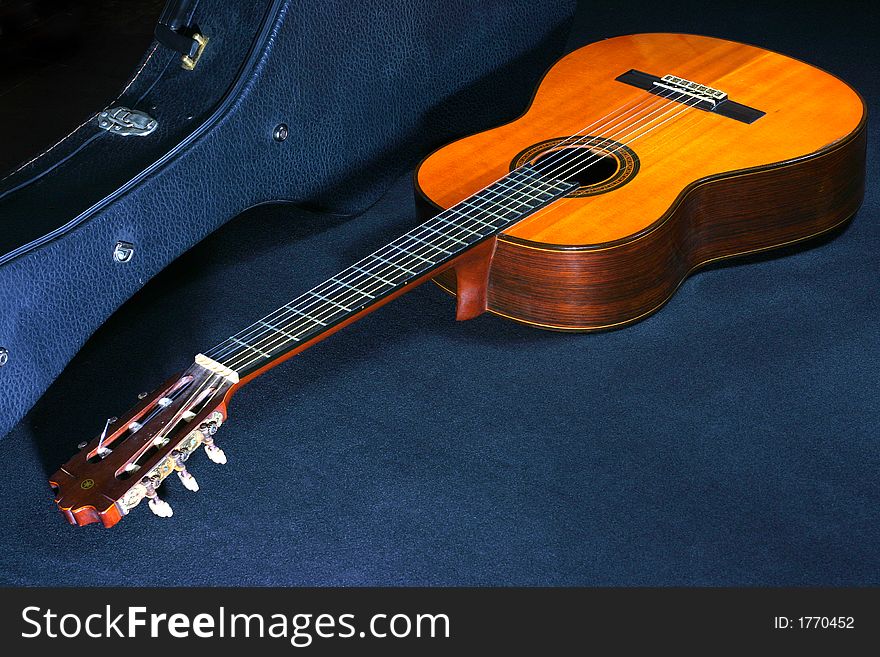 A close-up view of acoustic guitar in a guitar box