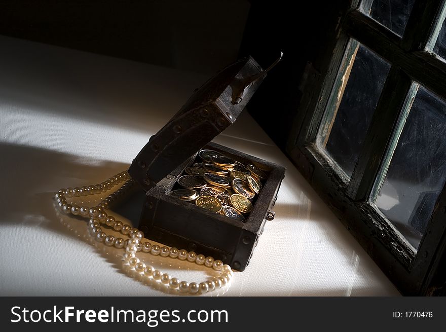 Treasure chest lit with light trough window. Treasure chest lit with light trough window