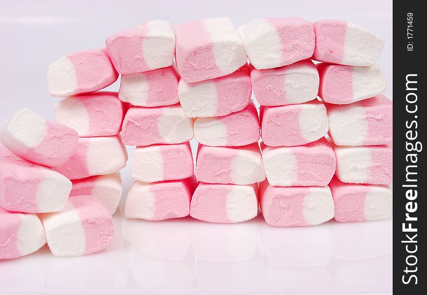 A lot of pink sweet candies. A lot of pink sweet candies