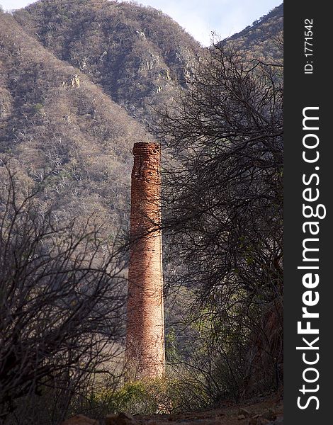 Abandoned chimeney of a factory  in the town of Alamos, in the northern state of Sonora, Mexico, Latin America