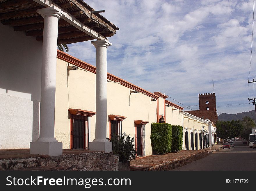 General view of a street, sidewalk and colonial houses in the centre of the town of Alamos in the northern state of Sonora, Mexico, Latin America