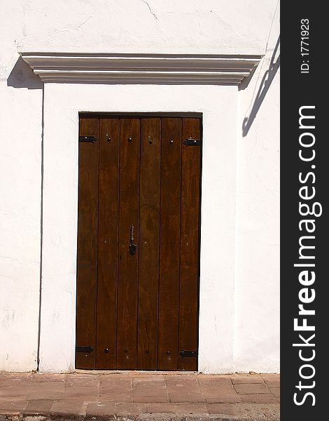 Detail of the wooden door of a colonial house in the town of Alamos in the northern state of Sonora, Mexico, Latin America