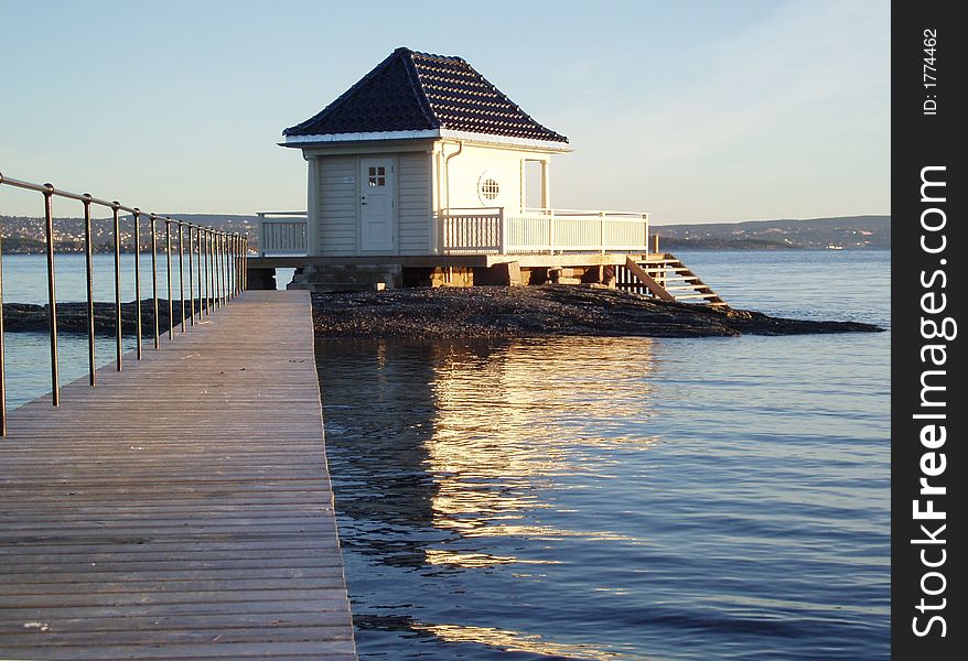 A bathhouse with terasses and stairs to the sea. Oslofjorden, Norway.