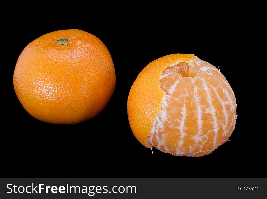 Pair tangerines isolated on black