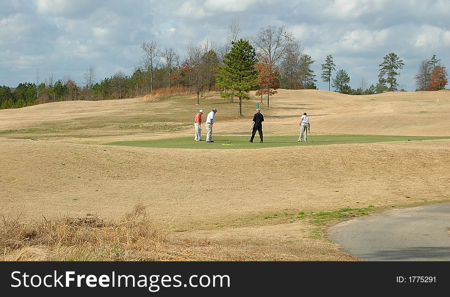 Photographed golfers at local course in Georgia.